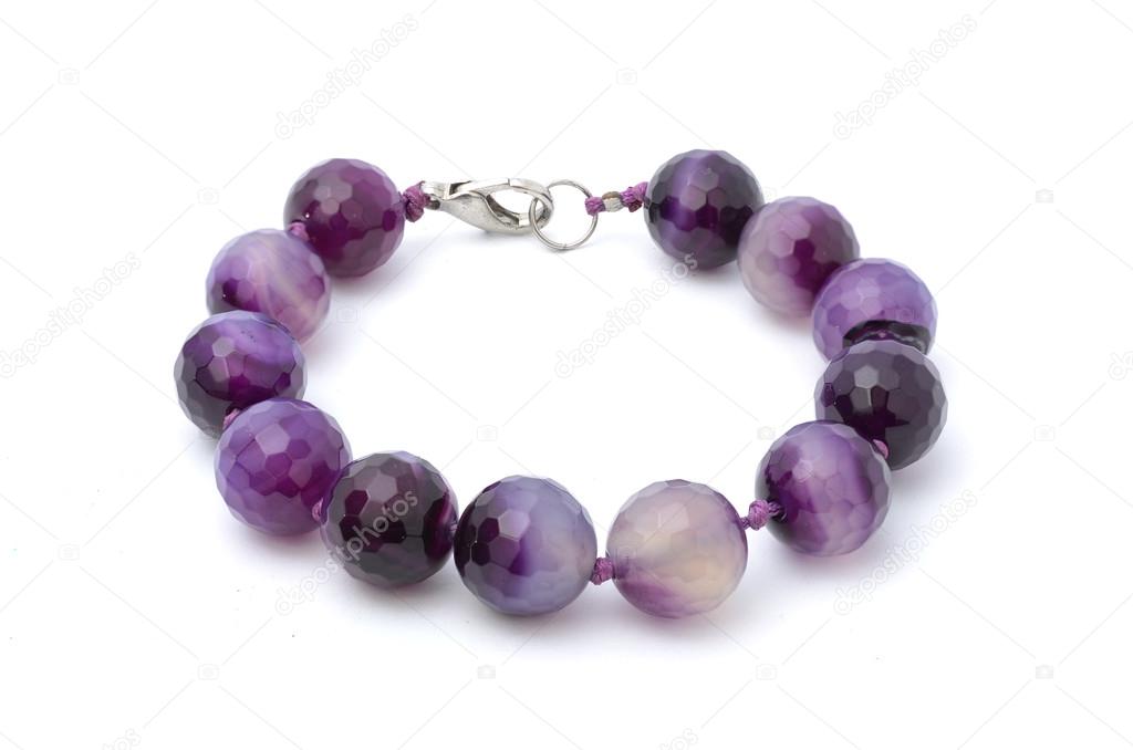 Bracelet with purple beads isolated