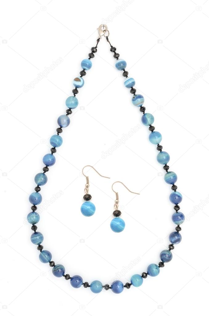 set of necklace and earrings from natural stones isolated