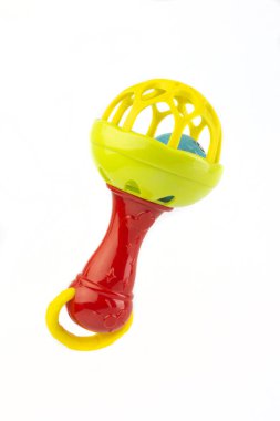 baby rattle with red handle isolated on white