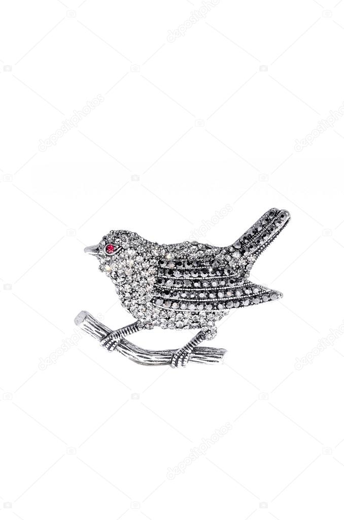 Silver brooch bird on a white background