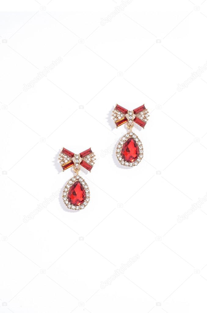 ruby earrings on a white background
