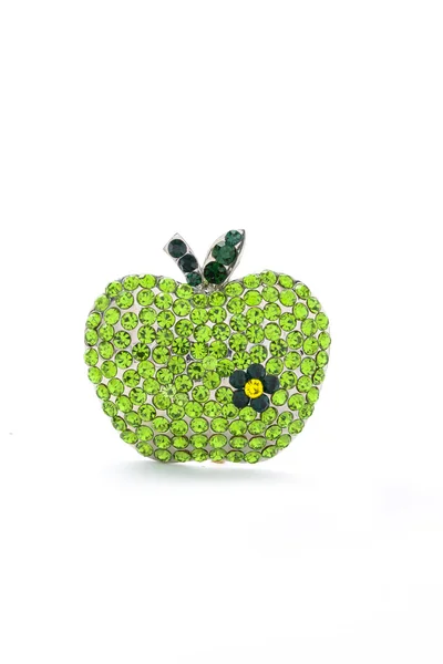 Broche de maçã verde em um fundo branco — Fotografia de Stock