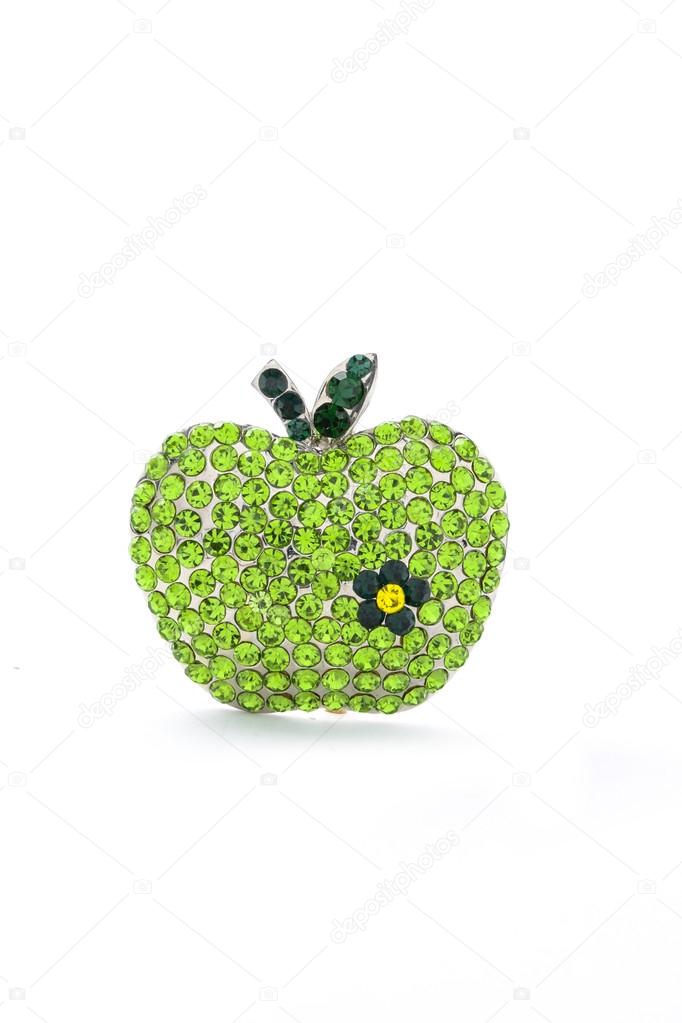 green apple  brooch on a white background