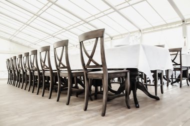 a row of chairs in the restaurant clipart