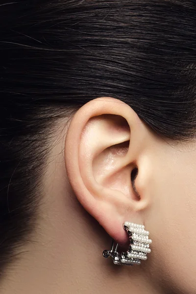 Ear with pearl earring — Stock Photo, Image