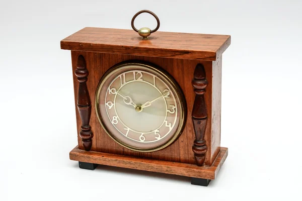 Viejo reloj de mesa sobre un fondo blanco — Foto de Stock
