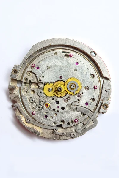 O mecanismo do relógio em um fundo branco — Fotografia de Stock