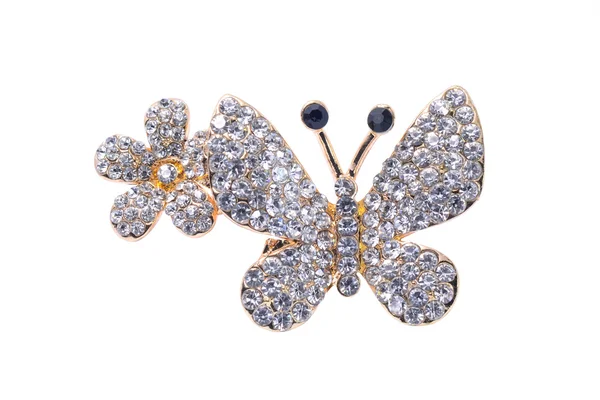 Broche de mariposa y flor aislada en blanco —  Fotos de Stock