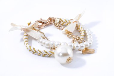 bracelet with pearls and pendants isolated on white clipart