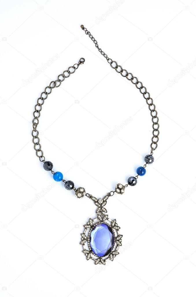 pendant with precious stones on a white background