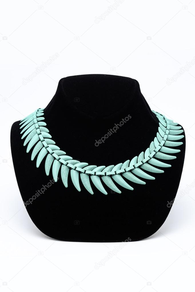 turquoise necklace on a mannequin