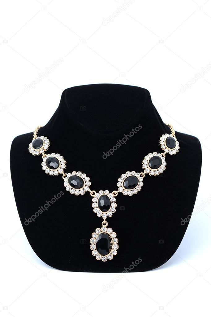 necklaces with gems on a mannequin isolated on white