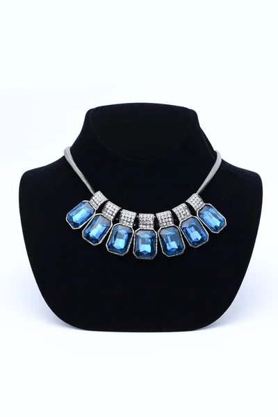 Necklace with blue stones on mannequin isolated on white — Stock Photo, Image