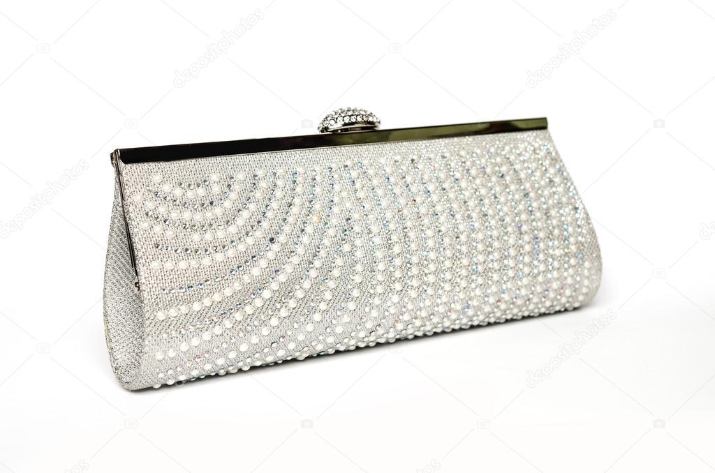 clutch with diamonds and pearls on a white background