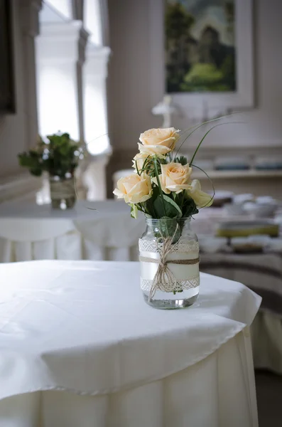 Bouquet in a vase and interior — Stock Photo, Image