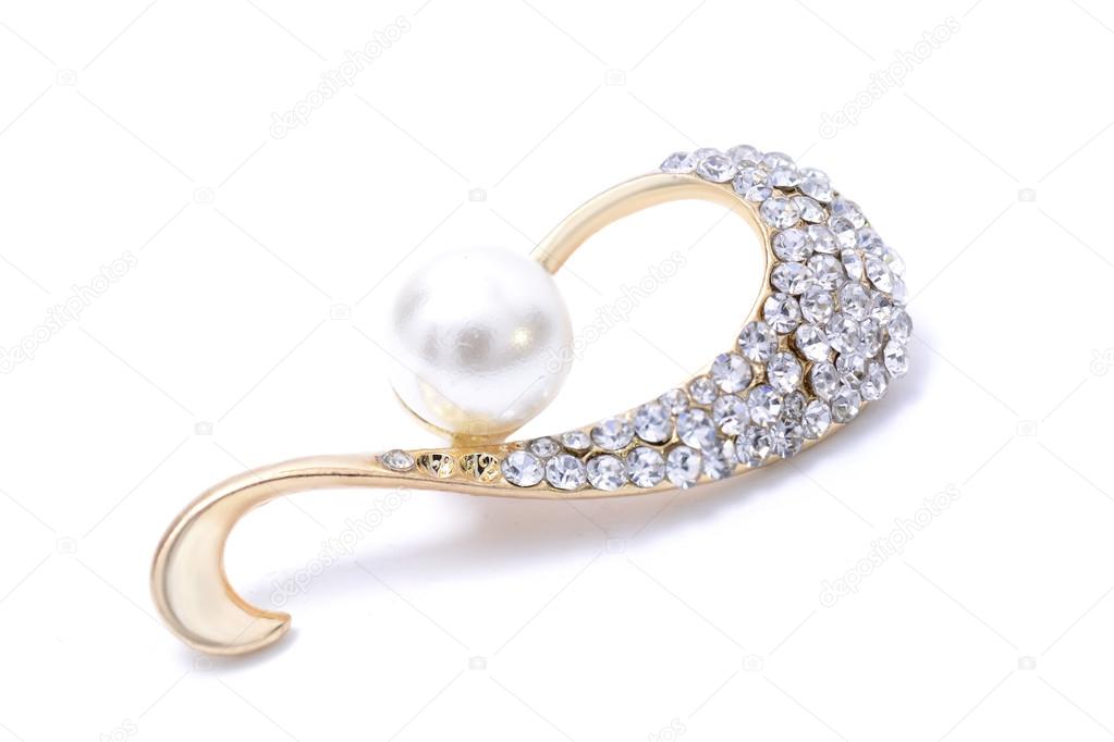 gold brooch with gems isolated on white