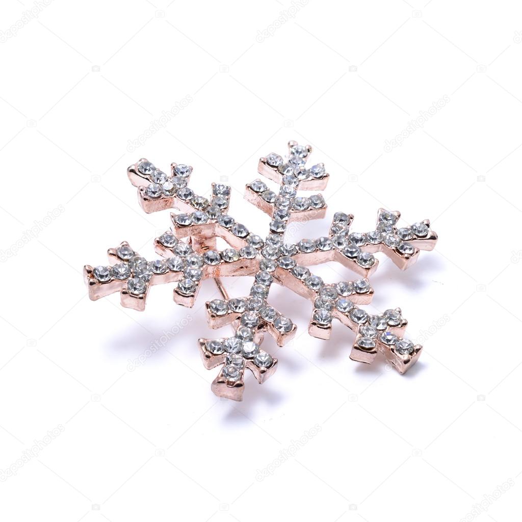 Snowflake brooch isolated on white