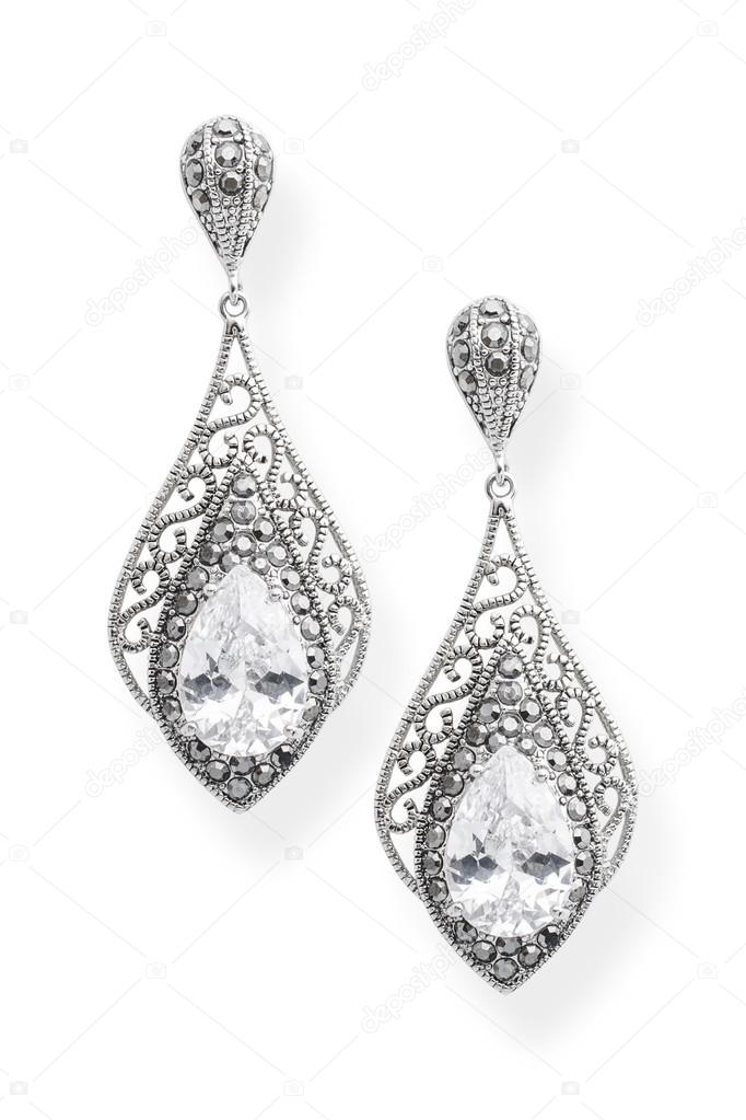 silver earrings with diamond isolated on white