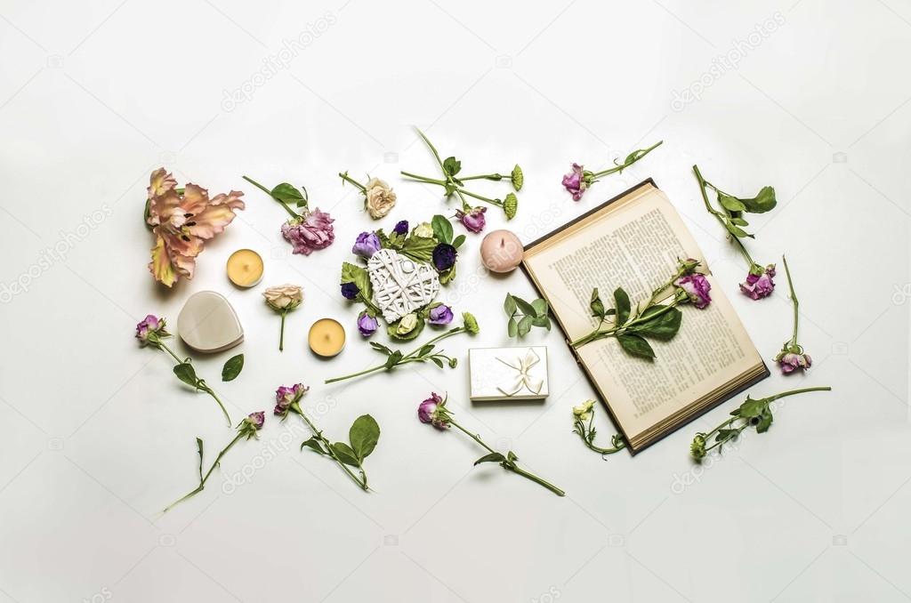 Still life with the book and flowers