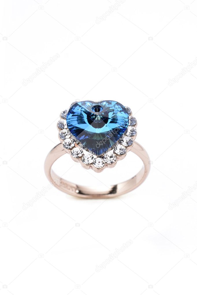 ring with a blue heart on a white background