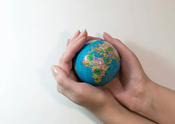Hold the globe in your hands and protect the planet Earth Stock Image