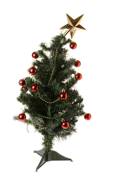 En üstteki plastik Noel ağacı beyazla izole edilmiş.