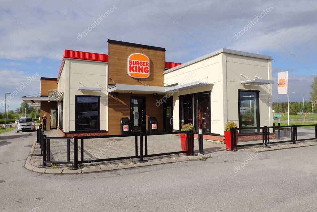 Eskilstuna, Sweden - May 17, 2021: Exterior view of the Burger King hamburger restaurant with the new retro logo.