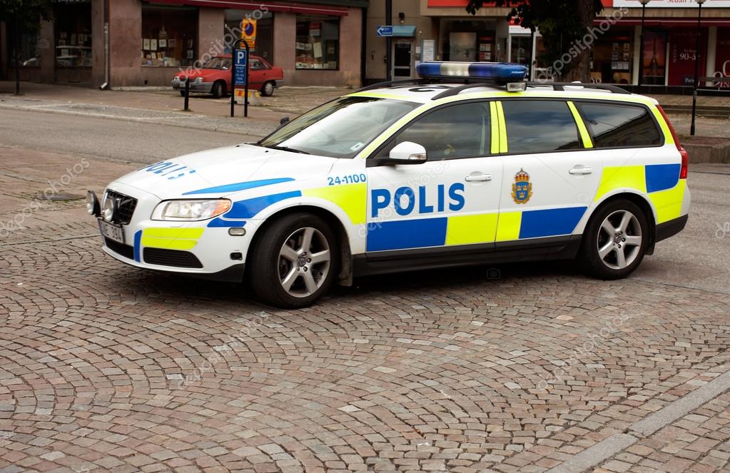 Vasteras, Sweden - September 16, 2012: Swedish police car with patrolling policemen in central Vasteras.