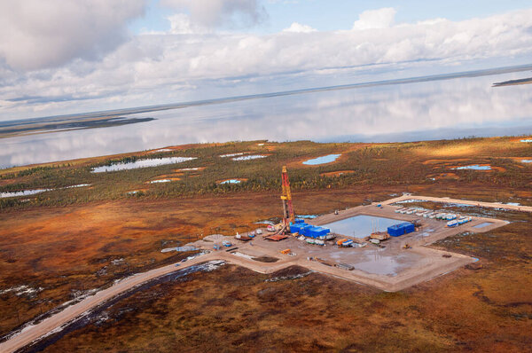  Oil rig in swampy and wooded area. There are clean lakes around. Oil production (top view)