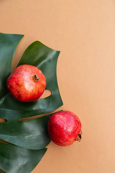 Pomegranate Fruit Monstera Palm Leaf Beige Background Place Text Healthy — Fotografia de Stock