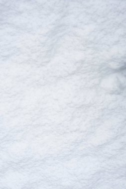 Kar dokusu. Soyut kış geçmişi. Beyaz karlı yüzey, yukarıdan görünüm.