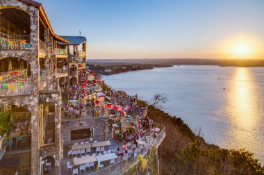 Austin, TX/USA - circa February 2016: Sunset above Lake Travis from The Oasis restaurant in Austin,  Texas clipart