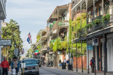 New Orleans, LA/USA - circa March 2009: Old Colonial Houses with ironwork galleries on the Streets of French Quarter decorated for Mardi Gras in New Orleans,  Louisiana
