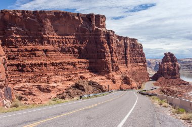 Highway descending to Lake Powell and Colorado River in Glen Canyon National Recreation  Area clipart