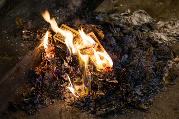 Burning money - 100 american dollar banknotes in  flames