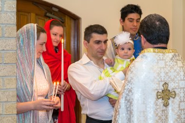 HOUSTON, TX/USA - 04 04 2015: Christian Baptising a girl in St. Kevork Armenian Church in Houston, TX,  USA