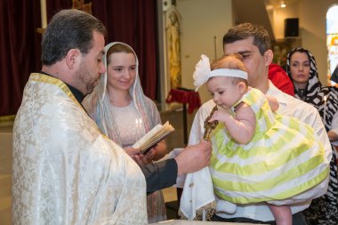 HOUSTON, TX/USA - 04 04 2015: Christian Baptising a girl in St. Kevork Armenian Church in Houston, TX,  USA