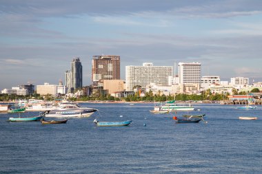 Pattaya, Thailand - 08 22 2015: Panorama of Pattaya, Thailand with bay and boats at  sunset