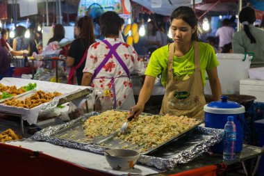 CHIANG MAI, THAILAND - CIRCA AUGUST 2015: Local people sell traditional Thai food and drinks at night market in Chiang Mai,  Thailand