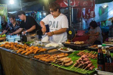 CHIANG MAI, THAILAND - CIRCA AUGUST 2015: Local people sell traditional Thai food and drinks at night market in Chiang Mai,  Thailand