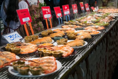 CHIANG MAI, THAILAND - CIRCA AUGUST 2015: Local people sell traditional Thai food and drinks at night market in Chiang Mai,  Thailand