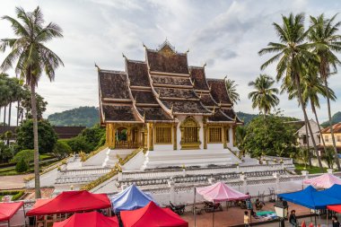 Luang Prabang, Laos - circa August 2015: Tents of night market and Royal Palace in Luang Prabang,  Laos