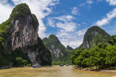 Karst mountains and limestone peaks of Li river in   China clipart