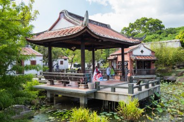 Taipei, Taiwan - circa September 2015: People dressed up in traditional costumes have photographic session in public park in Taipei city,   Taiwan