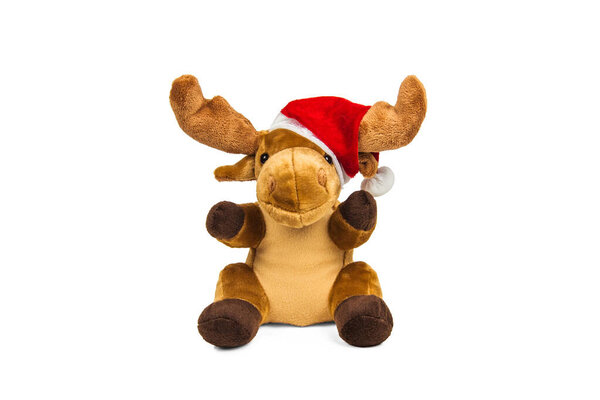 Stuffed toy Christmas deer in Santa Claus hat isolated on white background