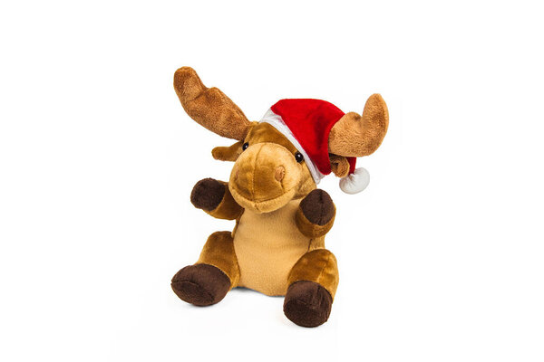 Stuffed toy Christmas deer in Santa Claus hat isolated on white background