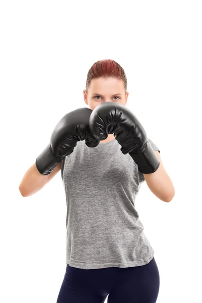 Junges Mädchen mit Boxhandschuhen blockiert — Stockfoto