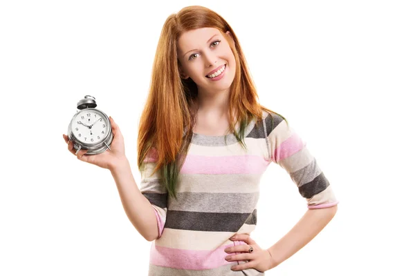 Smiling young girl holding an alarm clock — Stock Photo, Image