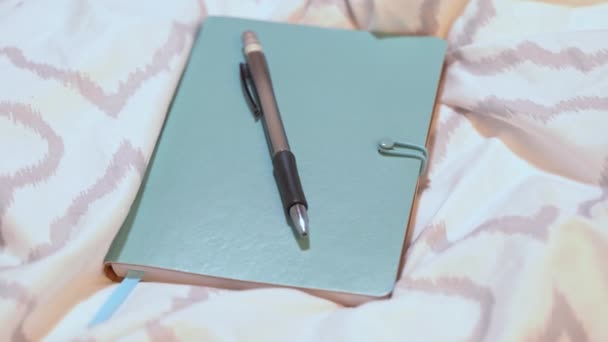 Notebook Pen Modern Bed Sheets Incoming Call Work Mobile Phone — Vídeos de Stock