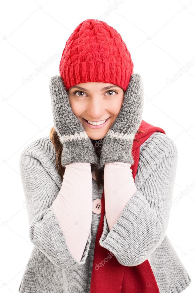Young girl holding her head wearing winter clothes